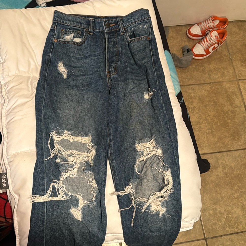 Dark blue ripped jeans